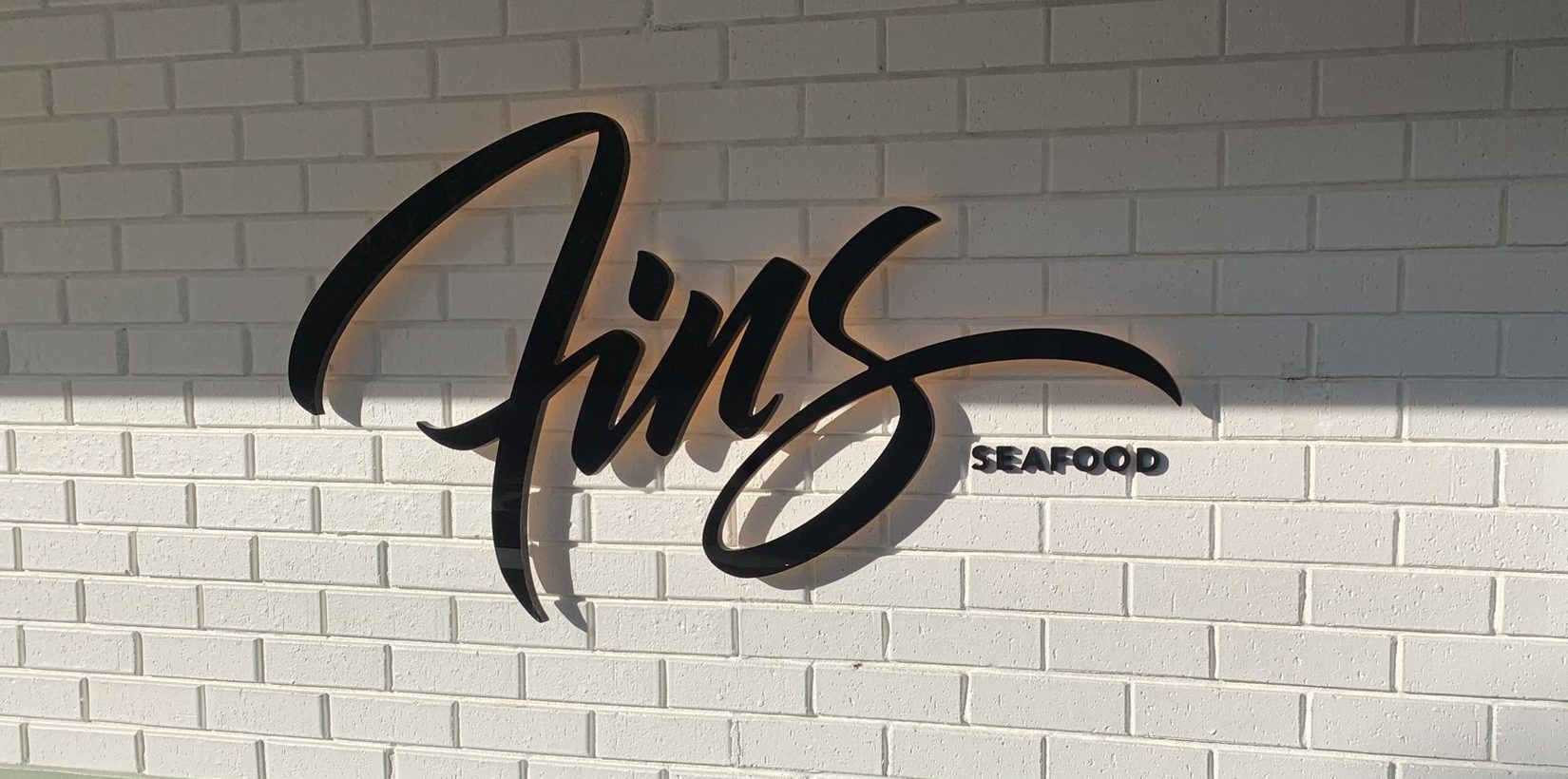 Fins Seafood backlit acrylic sign