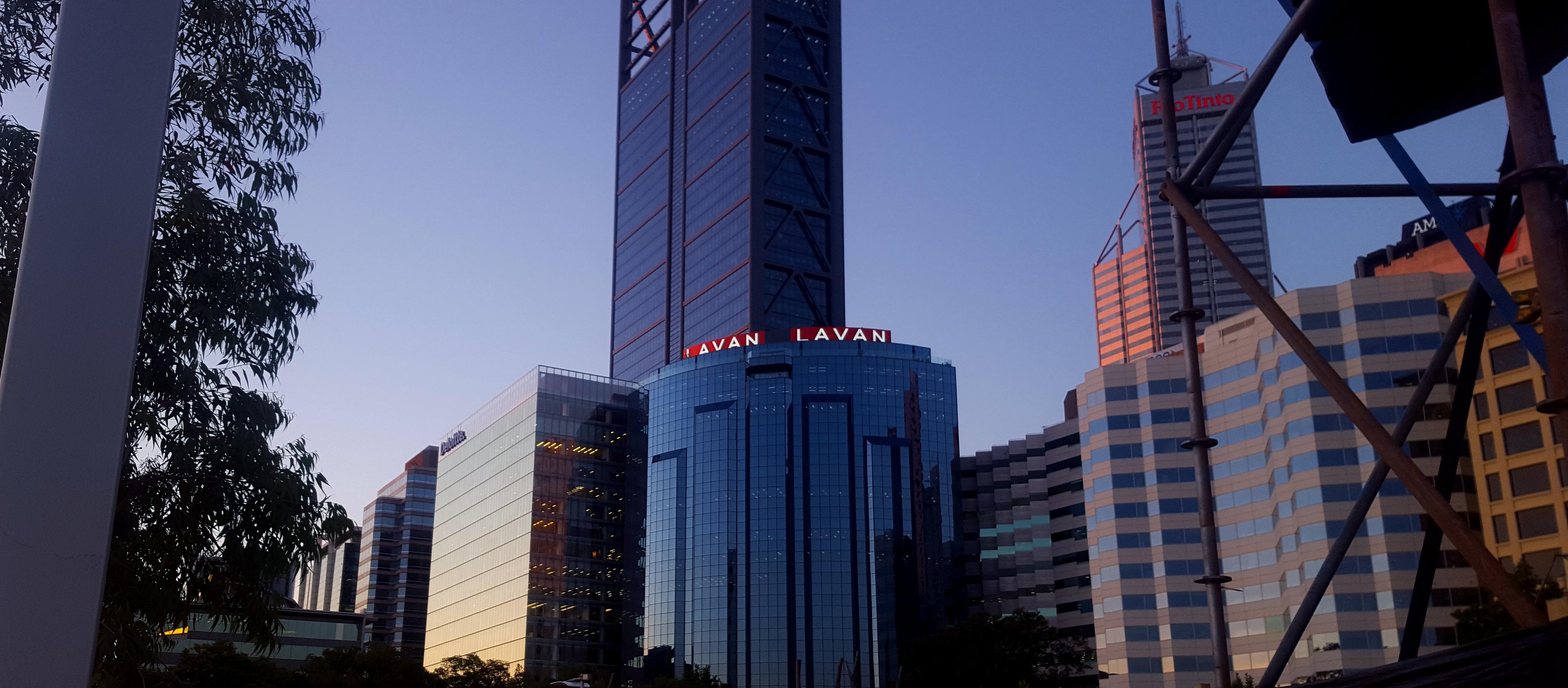 LAVAN Legal rooftop sky sign atop a Perth CBD tower at dusk